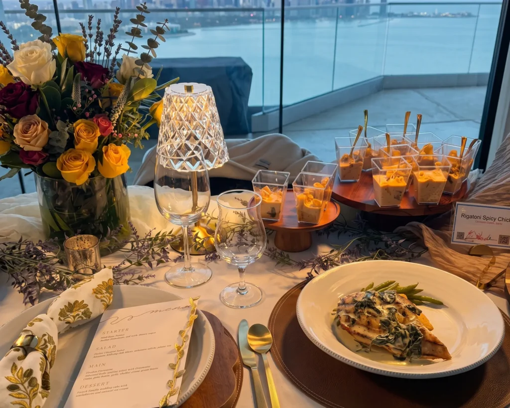 Cocktail table with flowers, canapes and drinks by a window